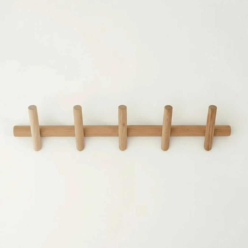 Nordvik oak coat rack mounted in a hallway with coats hanging