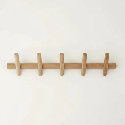 Nordvik oak coat rack mounted in a hallway with coats hanging